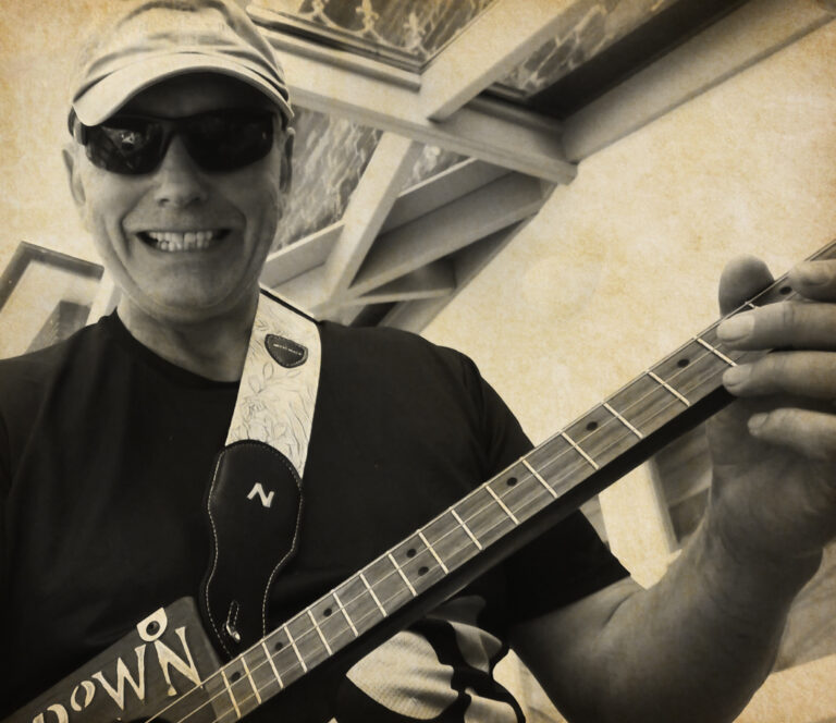 Peter playing his cigar box guitar